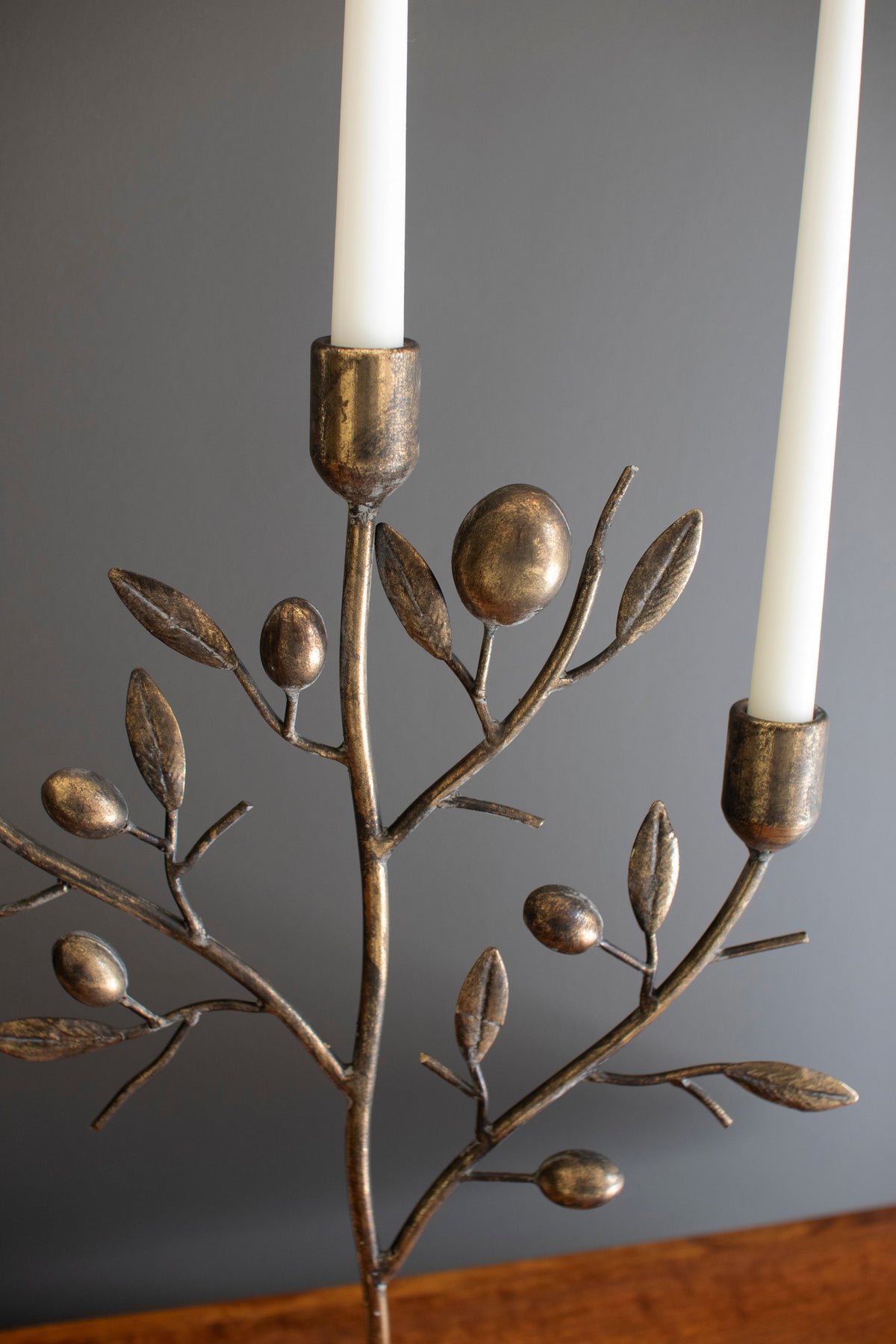 Vintage Style Antique Brass Taper Candelabra with sculpted branches and two white taper candles.