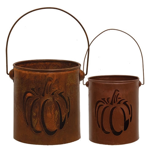 Two metal buckets with pumpkin designs on a white background