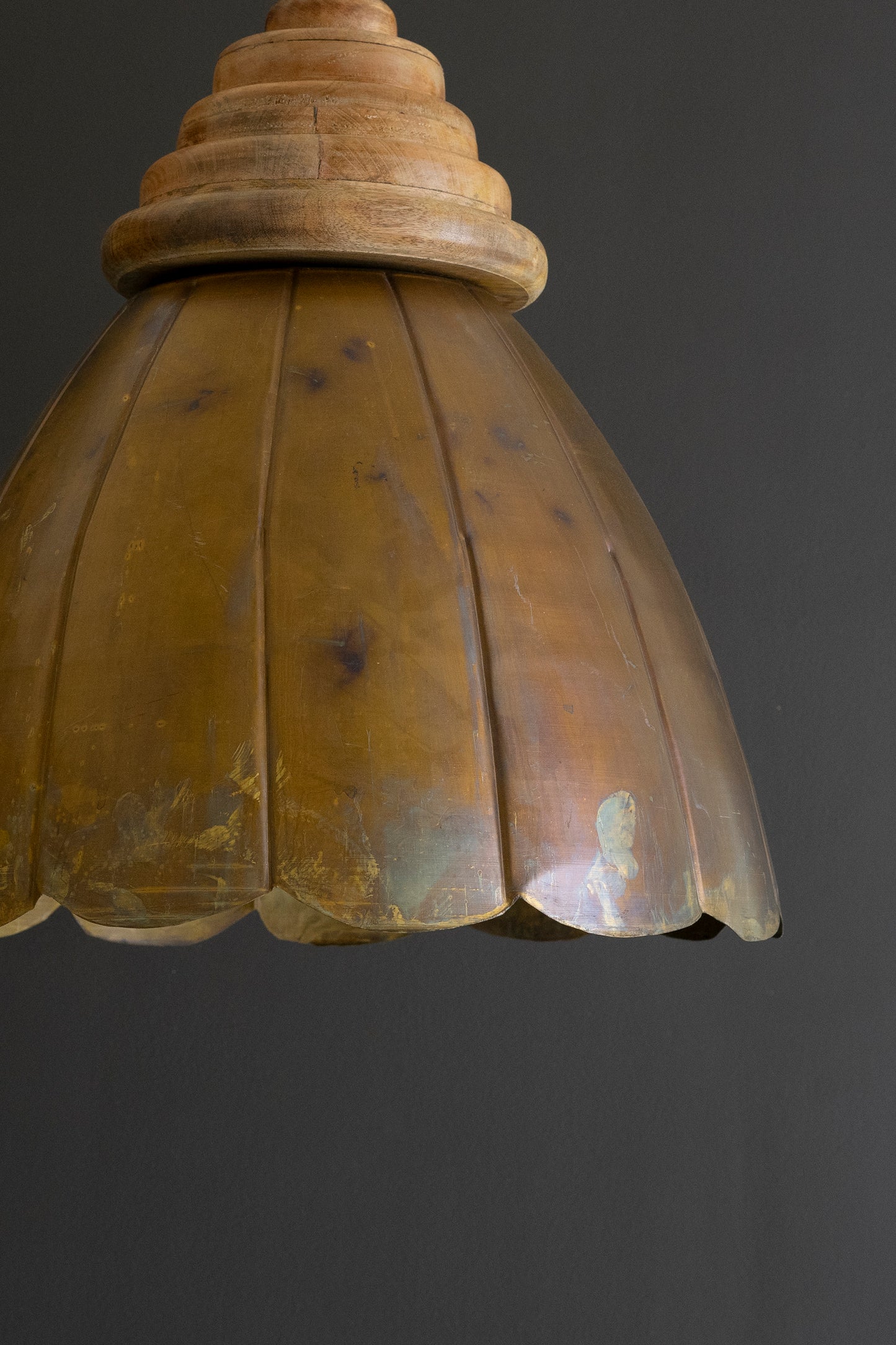 Small Antique Brass Pendant Light with Wood Detail showing scalloped brass dome and natural wood accents against dark background.