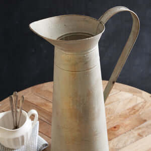 Tall metal pitcher with gold wash