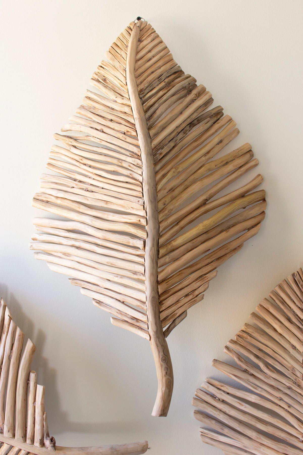 Teakwood Leaves Wall Art - Set of 3, featuring a large teakwood leaf design with a natural branch detail.