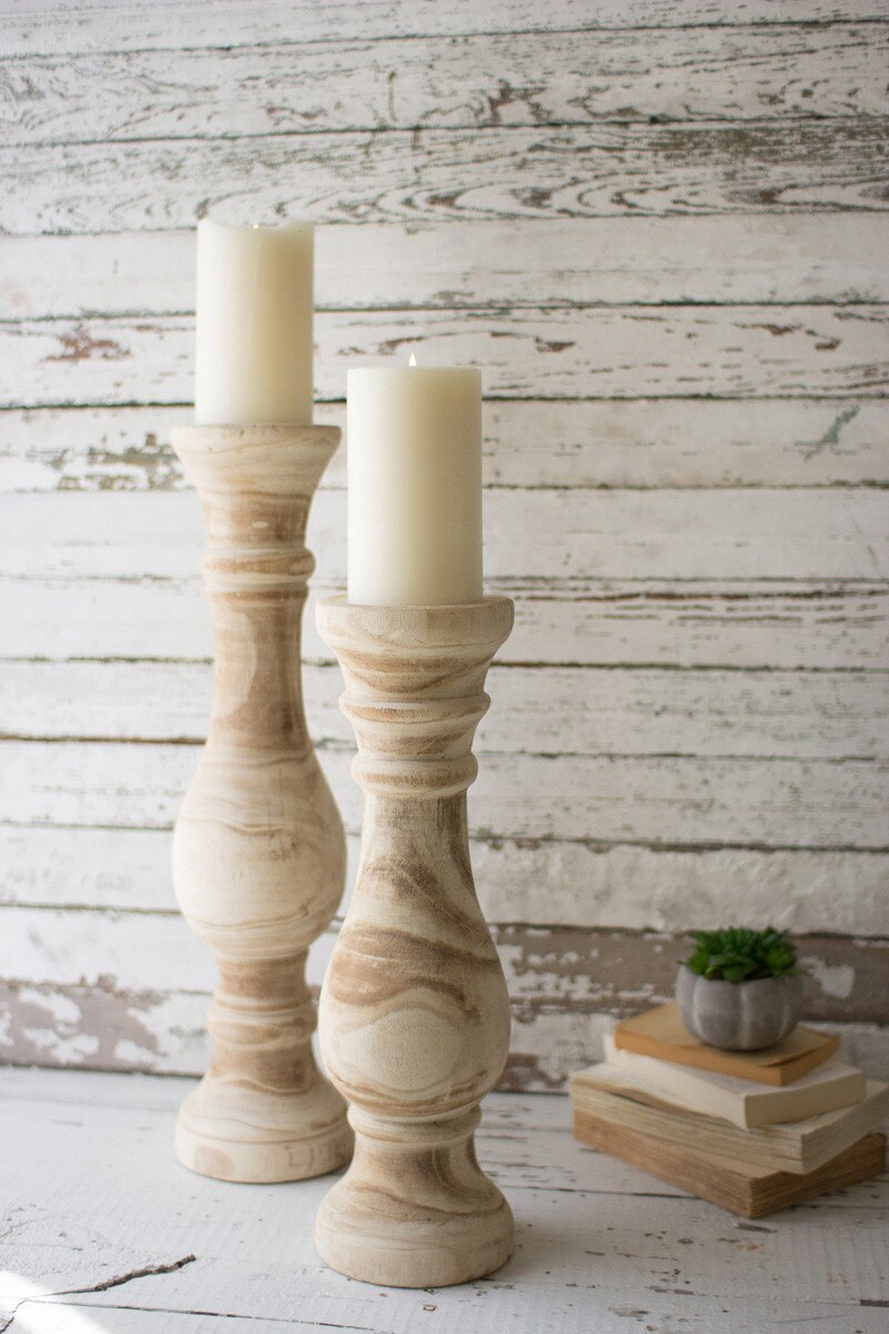 wood candle holders and book stack