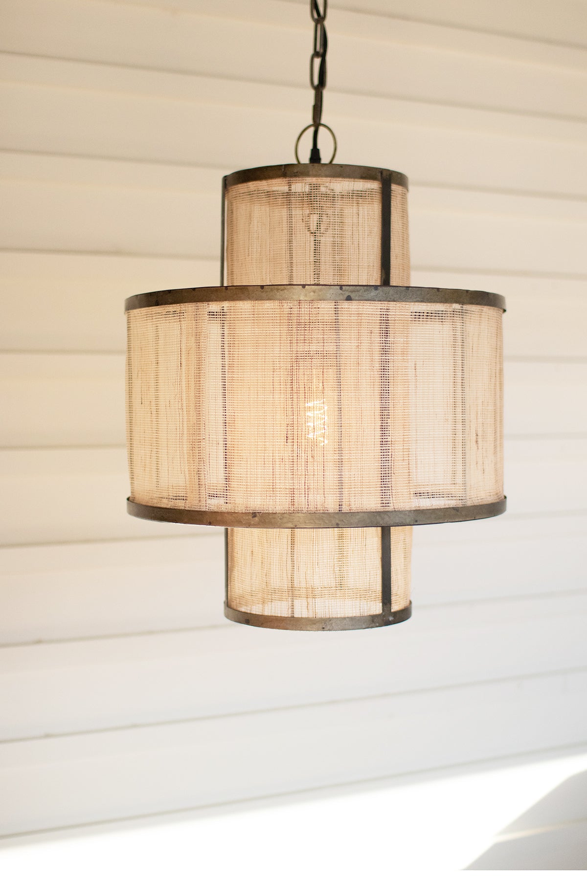 Rustic Layered Metal Pendant Light featuring a round double-layered design with woven fiber and metal accents.