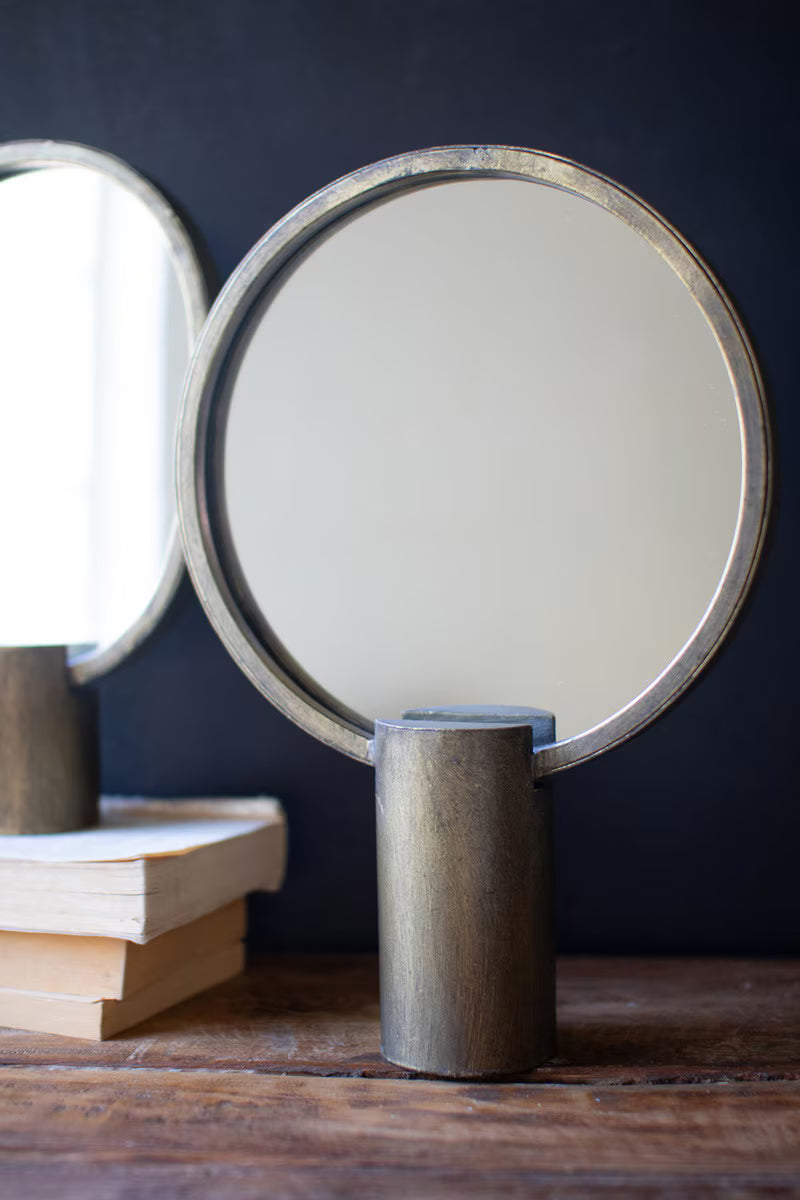 2 Round Antique Gold Mirrors with a dark background