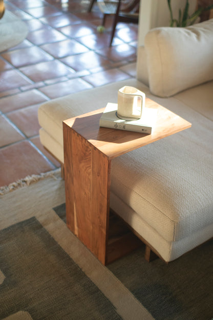 Acacia Wood Accent Table beside a sofa, holding a coffee mug and a book, perfect for a cozy modern rustic setting.