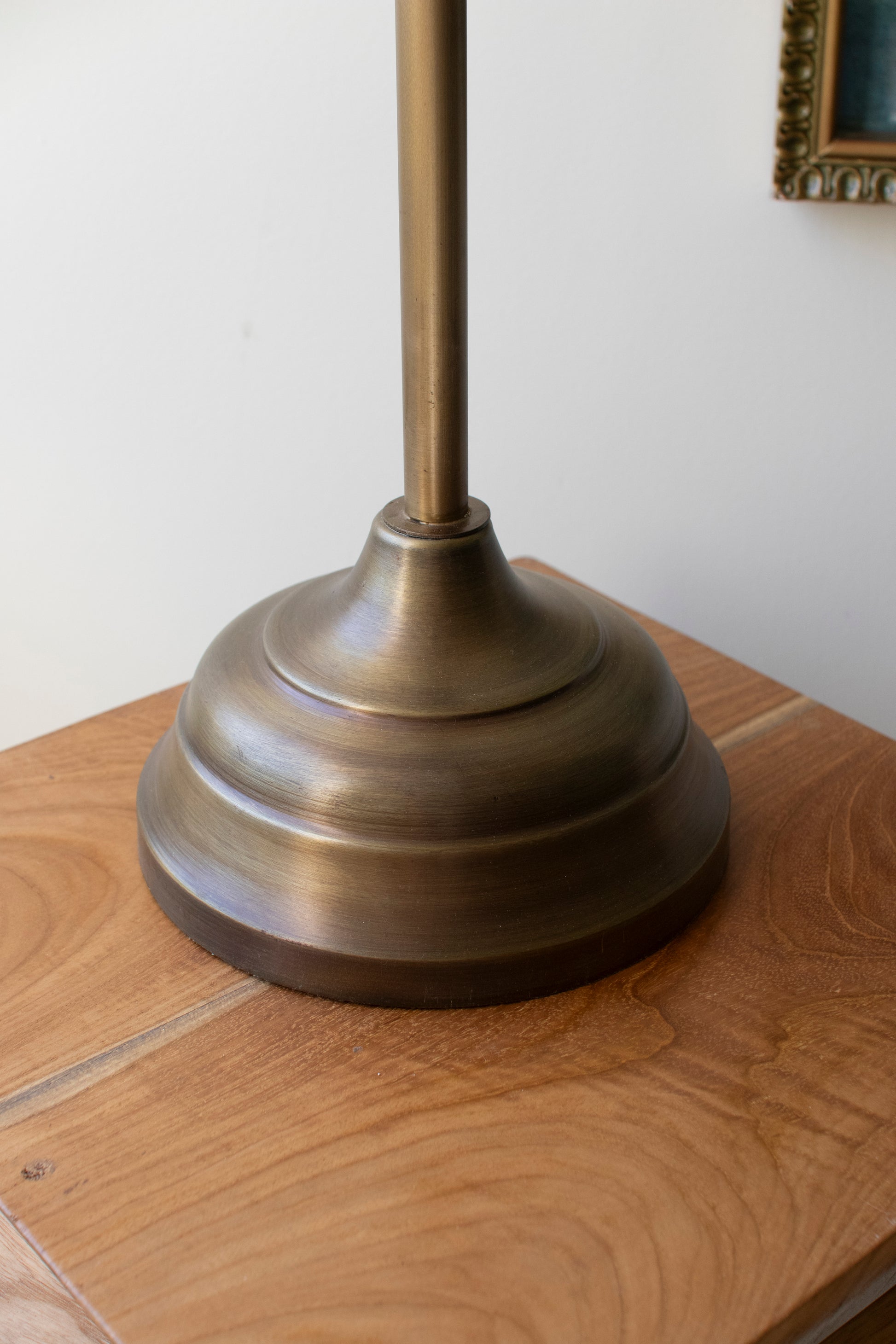 Antique Gold Table Lamp with Metal Shade base showcasing elegant design and authentic patina on a wooden table.