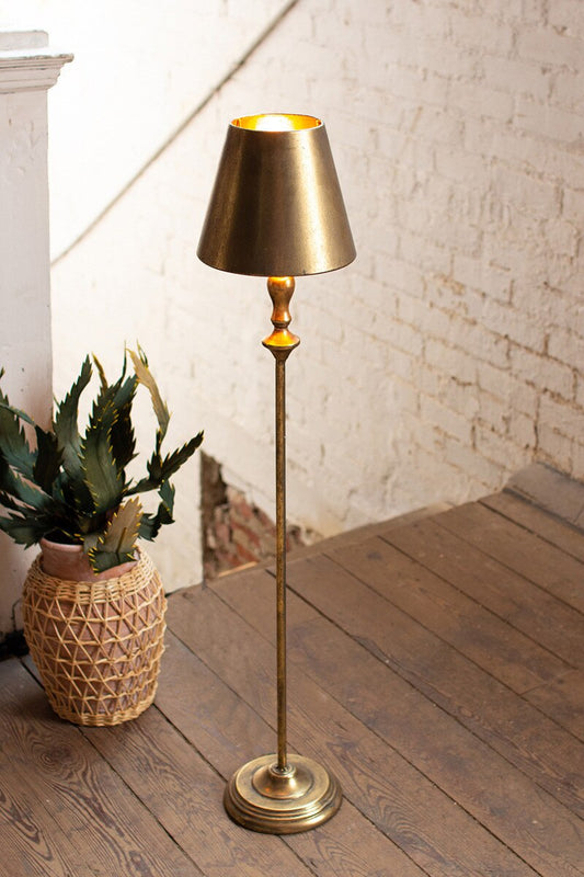 Antique Gold Table Lamp with Metal Shade on a wooden floor 