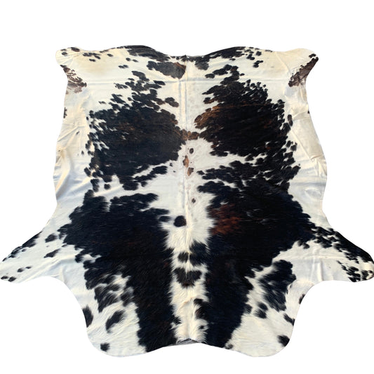 black brown and white - geniune cowhide rug with beautiful pattern, with natural imperfections due to unique nature of geniune cowhides.