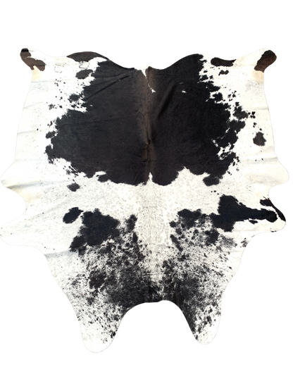 black and white  cowhide rug with beautiful pattern, with natural imperfections due to unique nature of geniune cowhides.