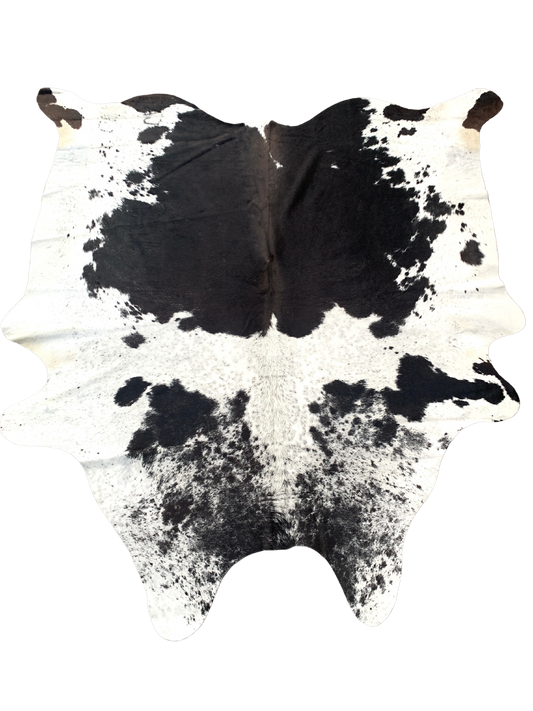 black and white  cowhide rug with beautiful pattern, with natural imperfections due to unique nature of geniune cowhides.