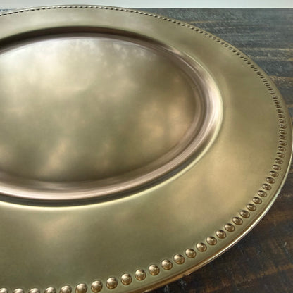 up close of bronze plate charger