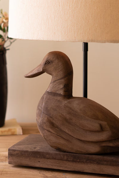 Carved Mango Wood Duck Lamp on Wooden table