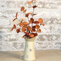 Red penny leaf pick styled in a fall arrangement