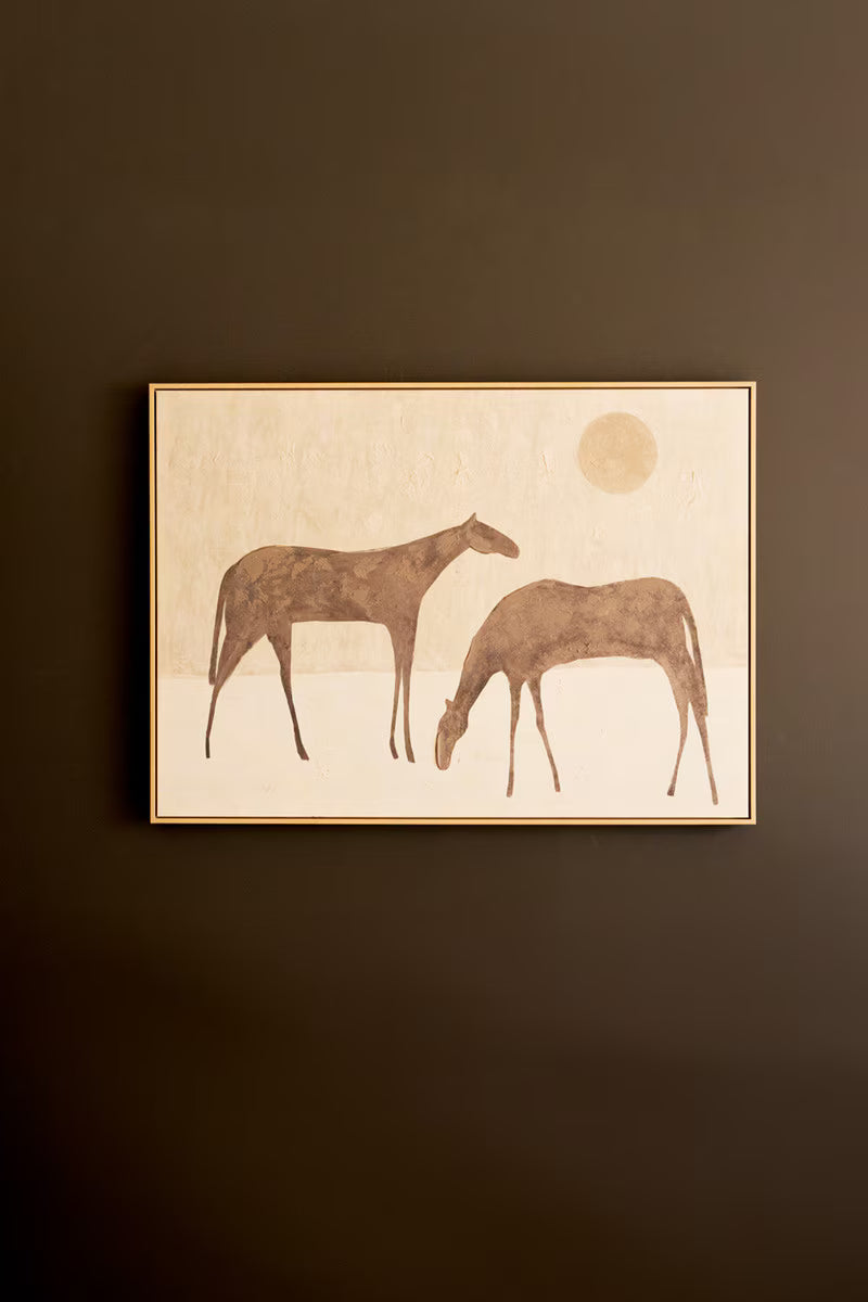 Framed Two Horses with Sun Artwork on a dark brown wall