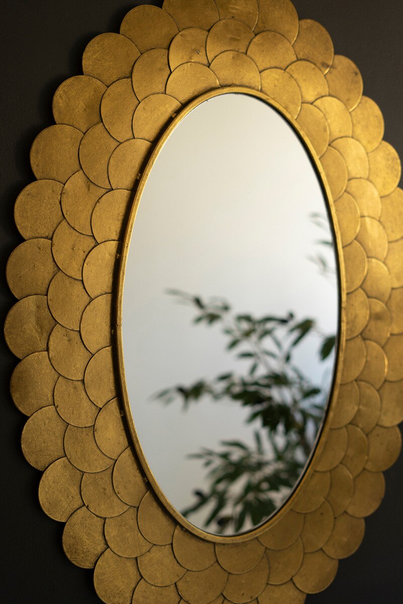 Gold Petal Framed Mirror on a dark background