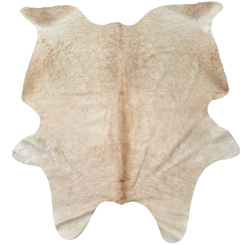 Beige cowhide rug on a white background