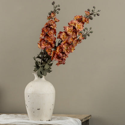 orange and pink faux foral in white vase