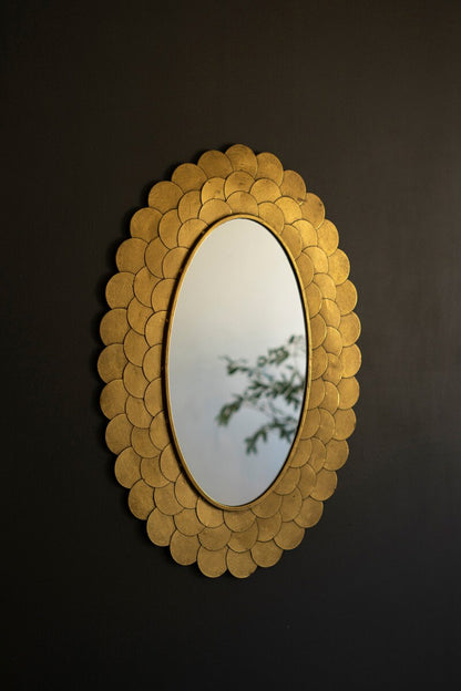 Layered Gold Scallop Framed Mirror on a dark wall