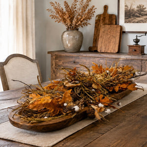 Fall centerpiece in wood bowl on dining room table
