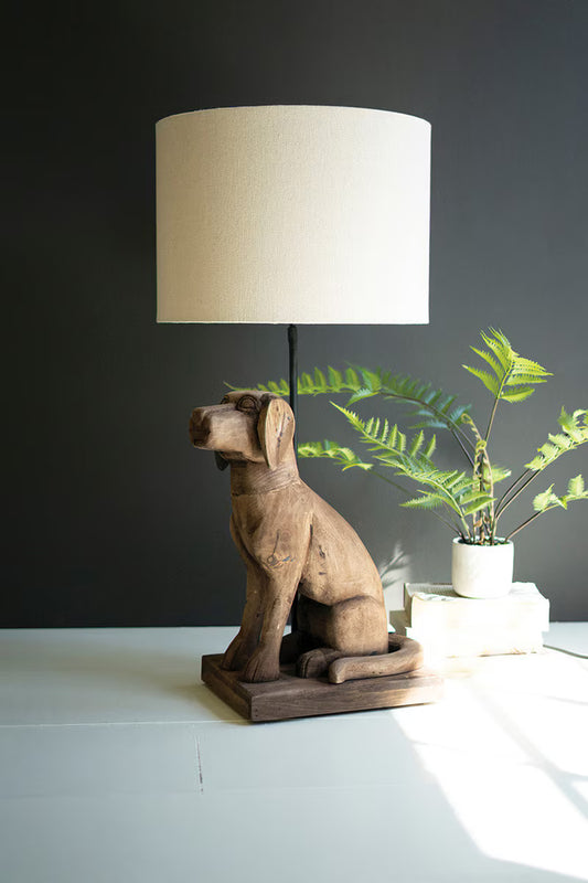 Wooden Dog Table Lamp with Fabric Shade on top of table