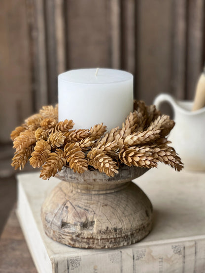 beige hops fall candle ring on wood candle holder with candle 