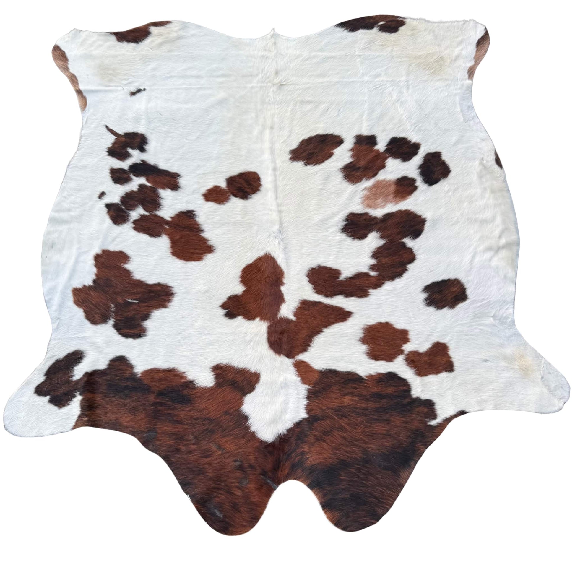 Cowhide rug with brown and white pattern on a white background
