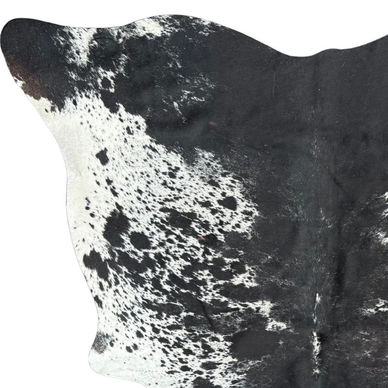 Close-up of a black and white cowhide rug