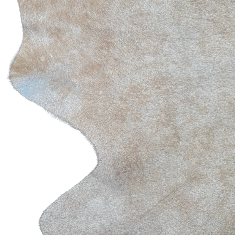 Close-up of a brown and beige cowhide rug on a white background