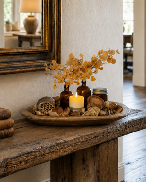 medium rustic wood dough bowl filled with fall decor