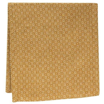 Gold patterned table runner on a white background
