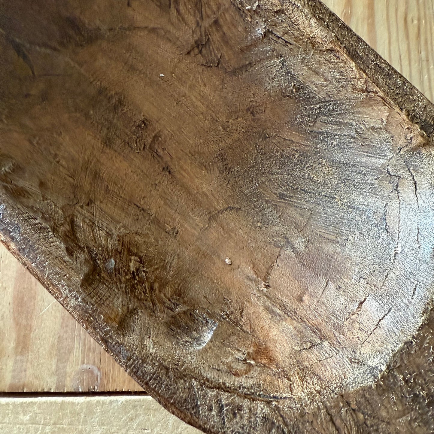 Close-up of a wooden bowl with visible grain and texture