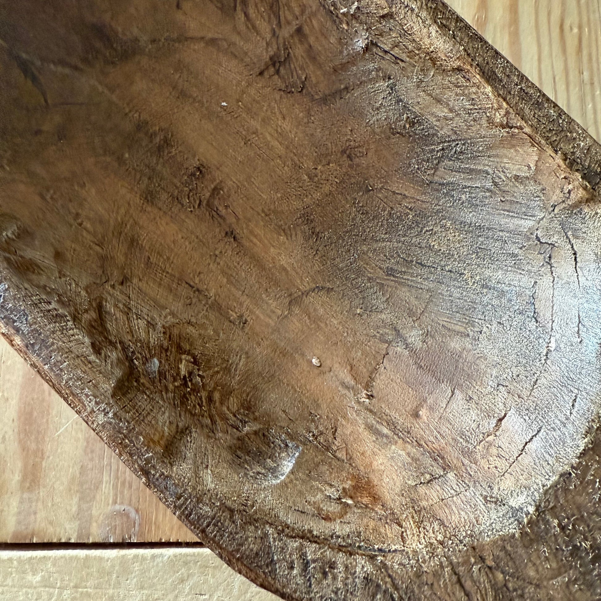 Close-up of a wooden bowl with visible grain and texture