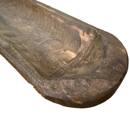 A rustic dark brown wooden bowl 
