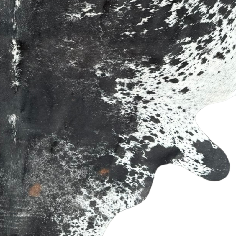 Close-up of a cowhide rug with black and white pattern