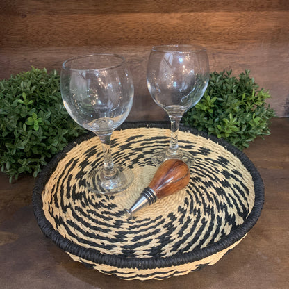 seagrass basket as serving tray with wine glasses and cork