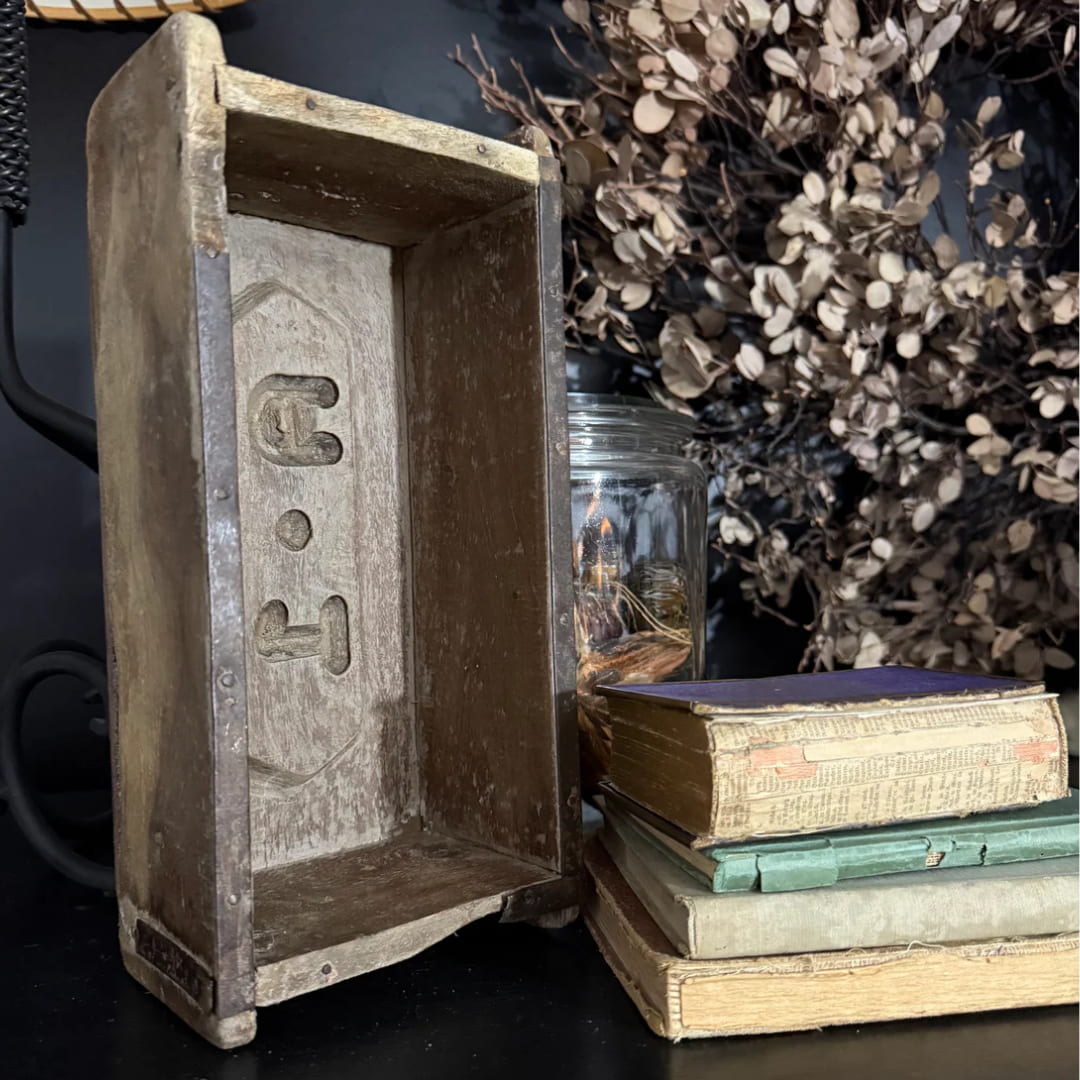 vintage brick mold and  stack of old books - home decor 