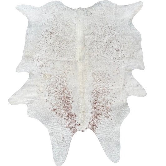 White cowhide rug with brown patches on a white background
